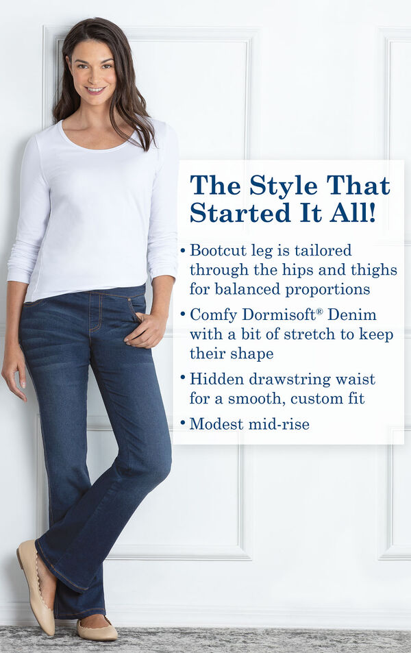 Model wearing Bootcut Indigo Wash PajamaJeans with the following copy: Bootcut leg is tailored through the hips and thighs for balanced proportions. Dormisoft Denim with a bit of stretch. Hidden drawstring waist for a custom fit. Modest mid-rise