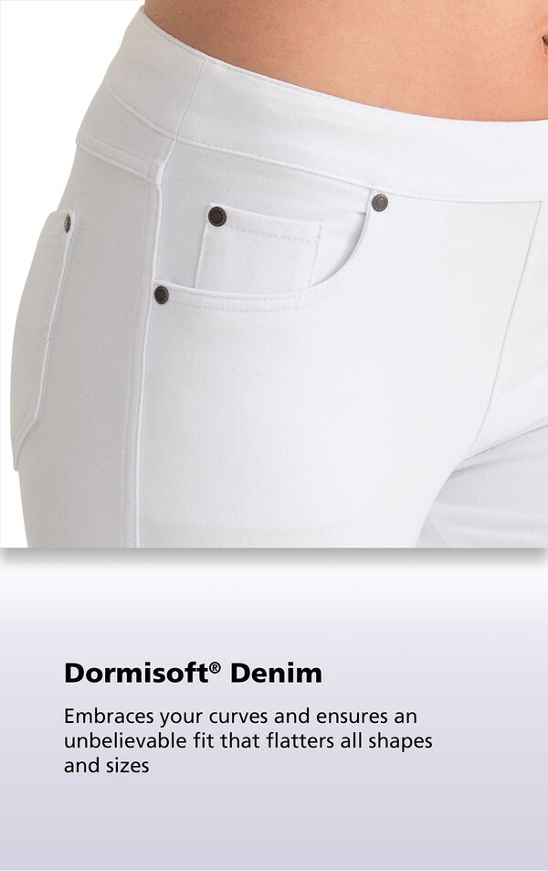 White fabric with the following copy: Dormisoft Denim - Embraces your curves and ensures an unbelievable fit that flatters all shapes and sizes.