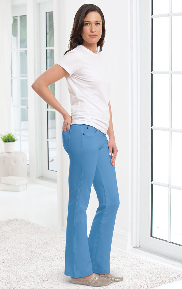 Model wearing Bootcut Cool Blue PajamaJeans paired with a white t-shirt and flats.