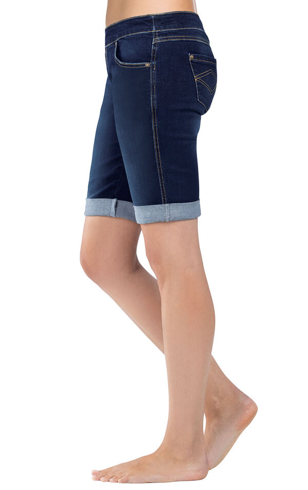 Close-up of model's waist and legs wearing PajamaJeans Bermuda Shorts Indigo, Cuffed, facing to the side