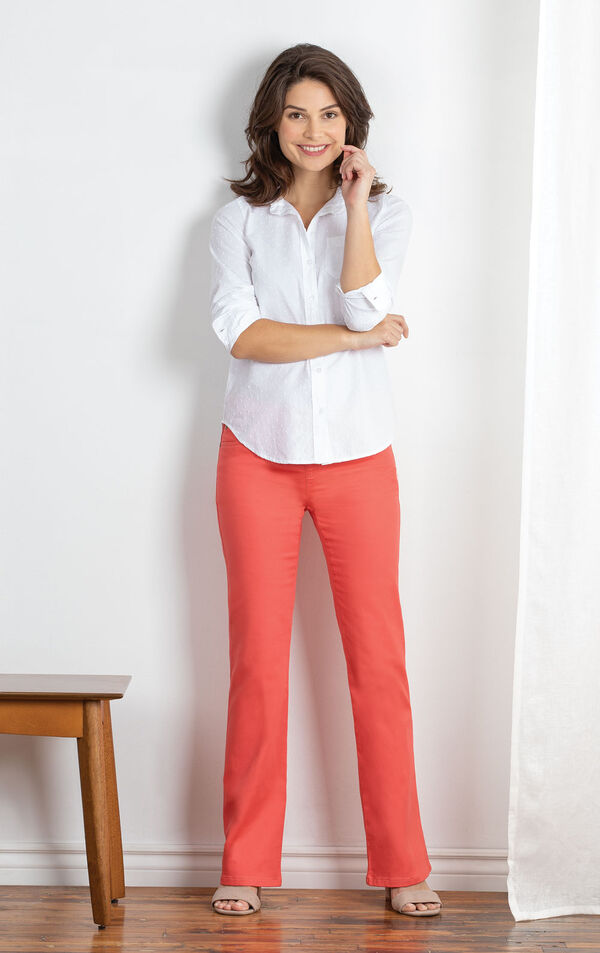Model wearing Coral Bootcut PajamaJeans with a white blouse, standing image number 3